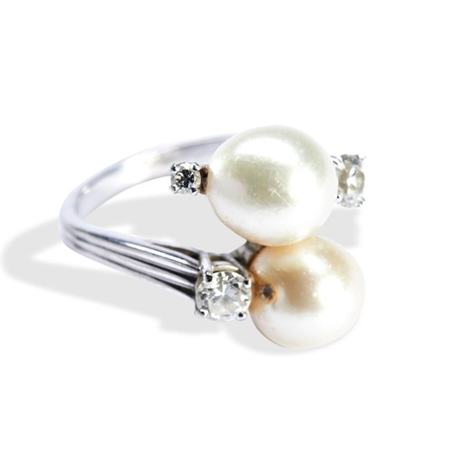 75 - A CULTURED PEARL & DIAMOND RING BY GUBELINtwo cultured pearls in a cross over setting, with claw... 