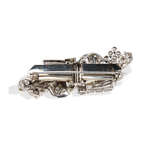 149 - A DIAMOND DOUBLE CLIP BROOCH CIRCA 1930the scrolling cross over design set through out with, bezel a... 