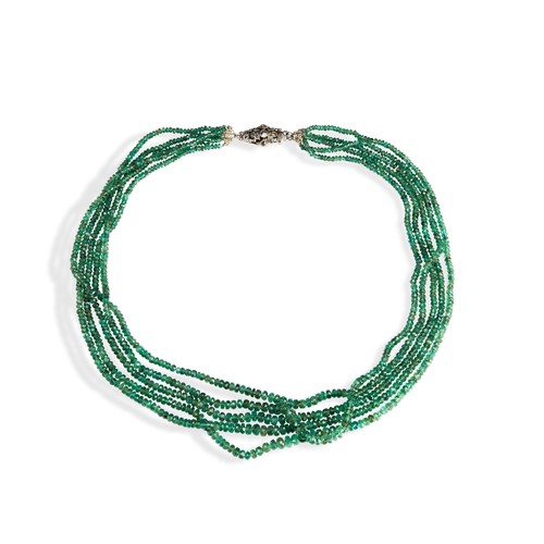 77 - A MULTI STRAND EMERALD BEAD NECKLACEfive strands of faceted emeralds beads on a decorative silver pu... 