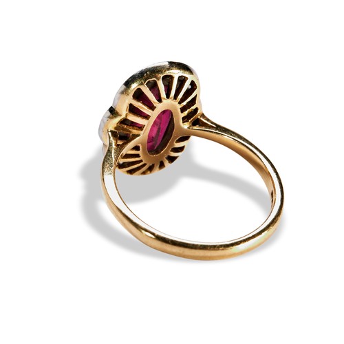 104 - A PINK TOURMALINE AND DIAMOND RINGoval mix cut, milgrain bezel set, pink tourmaline, surrounded by 2... 