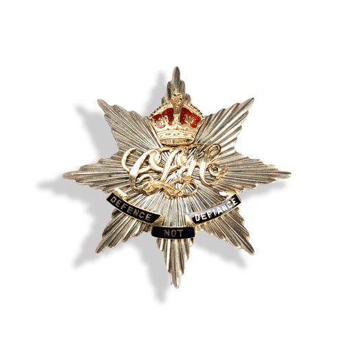 120 - A WWII 'DEFENCE NOT DEFIANCE' BADGEstar shaped with applied gold and enamel lettering, scroll and cr... 