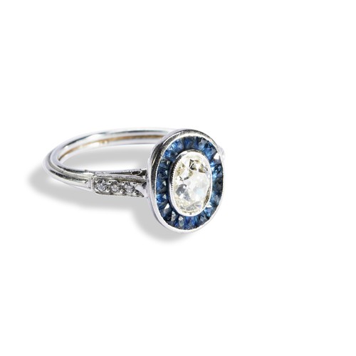 150 - AN ART DECO DIAMOND AND SAPPHIRE TARGET RINGthe milgrain bezel set, central oval old cut diamond bei... 