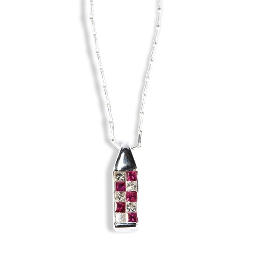 118 - A REVERSIBLE RUBY SAPPHIRE AND DIAMOND PENDANT NECKLACEA contemporary reversible pendant featuring o... 