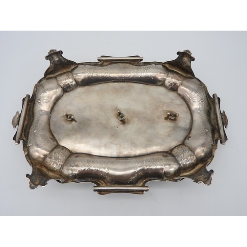 295 - AN ELEGANT SILVER INK STAND, profuse chased foliate decoration with scroll edge, raised on four scro... 