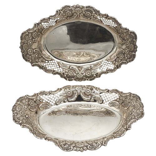 289 - A PAIR OF OVAL SILVER DISHES, scroll foliate repousse decoration with pierced panels, bearing the ma... 