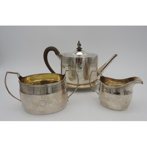 290 - A MATCHED GEORGE III SILVER FOUR PIECE TEA SERVICE, comprised of a teapot, trivet, milk jug and suga... 