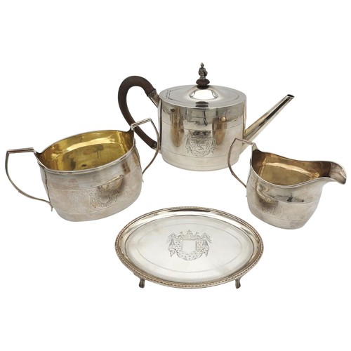 290 - A MATCHED GEORGE III SILVER FOUR PIECE TEA SERVICE, comprised of a teapot, trivet, milk jug and suga... 