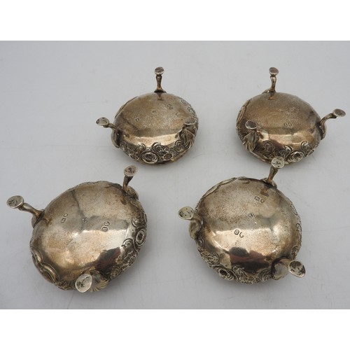 340 - A SET OF FOUR VICTORIAN SILVER SALTS, circular form, gadrooned rim with floral repousse decoration, ... 