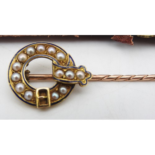 307 - A GOLD TIE PIN WITH CIRCULAR BUCKLE HEAD, inset with seed pearls, in original case