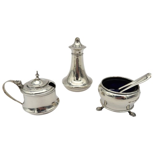 324 - A SILVER CRUET SET, wide waisted tapered form, consisting of a salt cellar with two spoons, a pepper... 