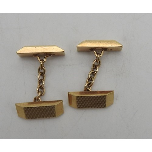 302 - A PAIR OF 9CT GOLD CUFFLINKS, CIRCA 1966, faceted ingot form with engine turned decoration,17.4 gram... 