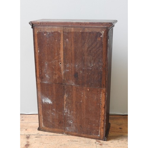 51 - AN OAK CABINET, 19TH CENTURYthe single panelled door enclosing two shelves and six small drawers, wi... 