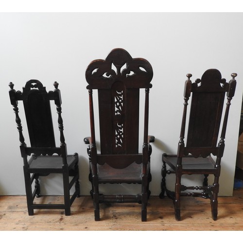 78 - EIGHT LATE 17TH CENTURY OAK HIGH BACK CHAIRS, comprised of an impressive armchair with pierced scrol... 