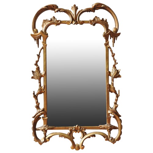 99 - AN ITALIAN GILT GESSO PIER MIRROR, 19TH CENTURYarch form with ornate scroll foliate carved pierced f... 