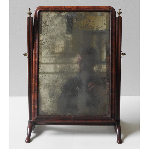 96 - A GEORGE II WALNUT TOILET MIRROR, MID 18TH CENTURYwith a bevelled plate in a moulded cushion frame, ... 