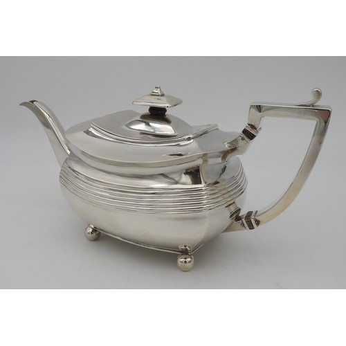 346 - A GEORGE III SILVER TEAPOT, CIRCA 1810boat shape form with fluted waist and elegant curved spout, ra... 