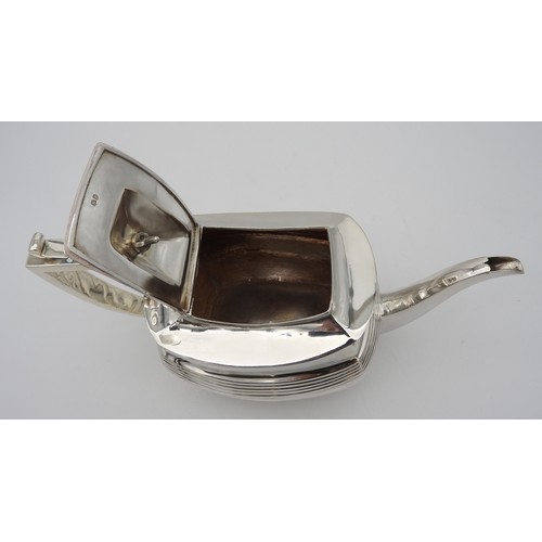 346 - A GEORGE III SILVER TEAPOT, CIRCA 1810boat shape form with fluted waist and elegant curved spout, ra... 