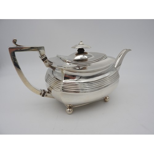 346 - A GEORGE III SILVER TEAPOT, CIRCA 1810boat shape form with fluted waist and elegant curved spout, ra... 