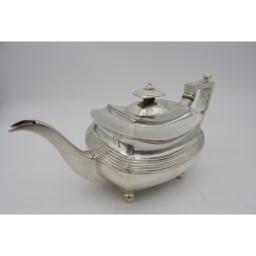 346 - A GEORGE III SILVER TEAPOT, CIRCA 1810boat shape form with fluted waist and elegant curved spout, ra... 