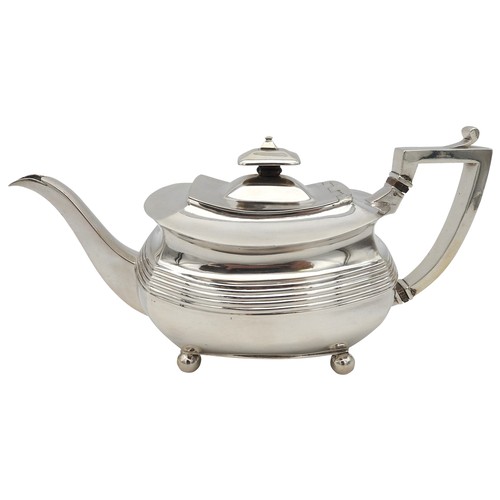 346 - A GEORGE III SILVER TEAPOT, CIRCA 1810boat shape form with fluted waist and elegant curved spout, ra... 