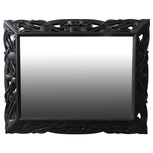 92 - A CARVED OAK WALL MIRROR, EARLY 20TH CENTURY, circa 1910, the bevelled plate surrounded by an art no... 