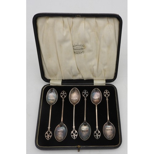 314 - A SET OF SIX SILVER ARTS & CRAFTS TEA SPOONS, in presentation case, elegant scroll arch handles,... 