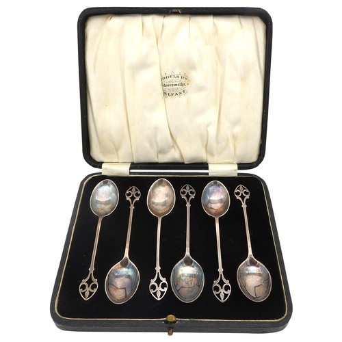 314 - A SET OF SIX SILVER ARTS & CRAFTS TEA SPOONS, in presentation case, elegant scroll arch handles,... 