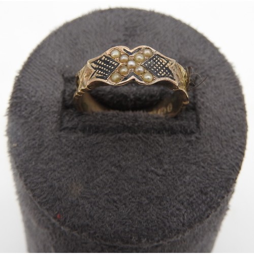 305 - A LATE VICTORIAN 9CT GOLD MOURNING RING, CIRCA 1898 the ring set with nine seed pearls , the ornatel... 