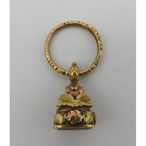 310 - A GOLD AND WHITE AGATE INTAGLIO FOB, 19TH CENTURY, the ornate fob with floral and foliate decoration... 