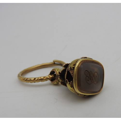 310 - A GOLD AND WHITE AGATE INTAGLIO FOB, 19TH CENTURY, the ornate fob with floral and foliate decoration... 