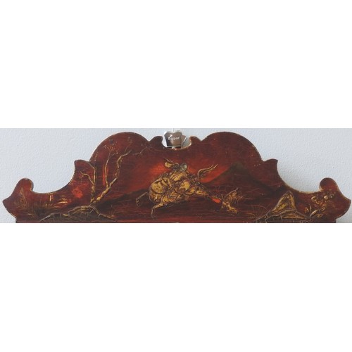 94 - A JAPANNED WALL MIRROR, CIRCA 1910the fret cut pediment with chinoiserie decorated scene depicting h... 