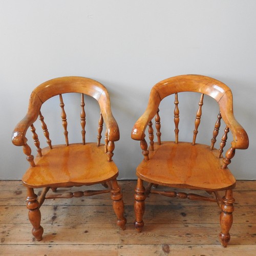 82 - A SET OF SIX 19TH CENTURY GOLDEN OAK SMOKERS BOW CHAIRS, curved scrolling top rail supported by grad... 