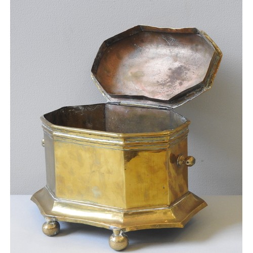 207 - AN EARLY 19TH CENTURY DUTCH BRASS TOBACCO BOX, octagonal shaped sarcophagus form, the domed lid surm... 