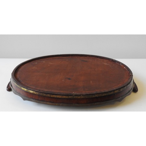 67 - A GEORGE III MAHOGANY COOPERED TRAY, oval form with two scroll handles and shaped gallery edge63 x 3... 