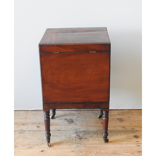 43 - A REGENCY MAHOGANY TEAPOY, CIRCA 1820, simplistic square form, the hinged top enclosing zinc cannist... 