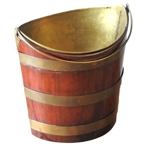 84 - A GEORGE III MAHOGANY BRASS BOUND OYSTER BUCKET, CIRCA 1780, navette form, with swing handle and rem... 