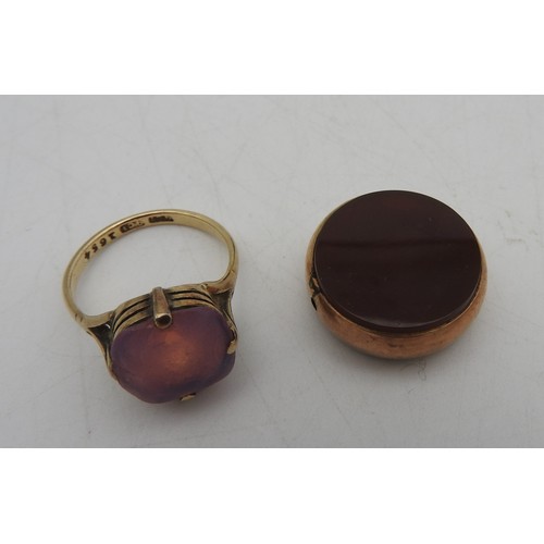 297 - A 19TH CENTURY GOLD MOUNTED FOB, circular form, mounted with Bloodstone and Carnelian, stamped .375,... 