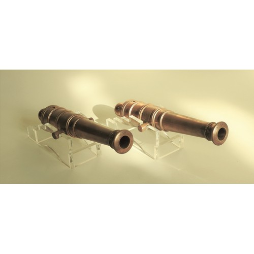 201 - A PAIR OF POLISHED BRONZE CANNON REPLICAS, LATE 19TH CENTURY, based on 18th century British naval ca... 