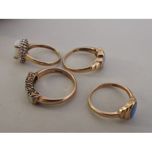 304 - FOUR OPAL SET GOLD RINGS, various styles and settings, three 9ct gold and one 14 ct goldtotal combin... 