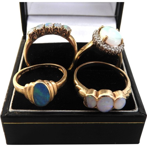 304 - FOUR OPAL SET GOLD RINGS, various styles and settings, three 9ct gold and one 14 ct goldtotal combin... 