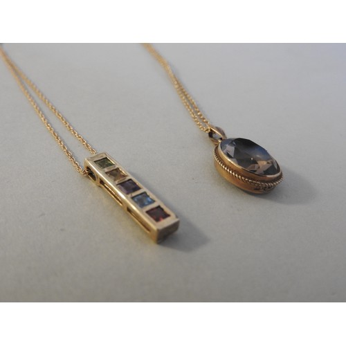 299 - TWO GOLD GEM SET PENDANT NECKLACES, set with semi-precious stones, both stamped .375both 24 cm longc... 