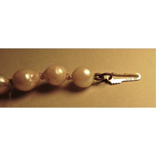 296 - TWO CULTURED PEARL NECKLACES AND TWO VINTAGE SILVER CHERUB BROOCHES, both necklaces with 9ct gold cl... 