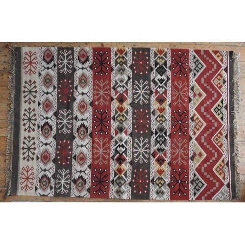 115 - A HAND KNOTTED KHELIM RUG, 20TH CENTURY, alternating vertical bands emblazoned with geometric motifs... 