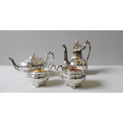 348 - A SILVER FOUR PIECE TEA SERVICE, compressed melon form with alternating repousse decoration depictin... 