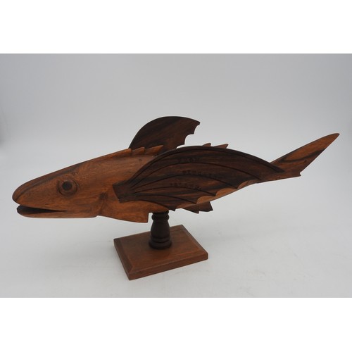 282 - A VINTAGE CARVED SOUVENIR FLYING FISH, CIRCA 1950, carved from Miro wood by inhabitants of Pitcairn ... 