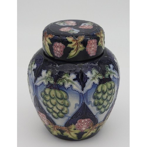 373 - A MOORCROFT JAR & COVER, CIRCA 2003, baluster form in the Chinese style, vibrant grape and vine ... 