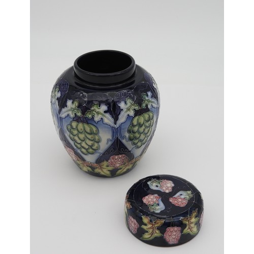 373 - A MOORCROFT JAR & COVER, CIRCA 2003, baluster form in the Chinese style, vibrant grape and vine ... 