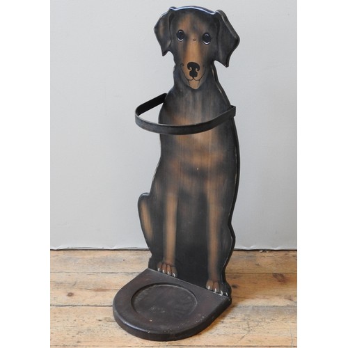 377 - A PAINTED PINE STICK STAND, 20TH CENTURY, in the form of a seated hound79 cm high