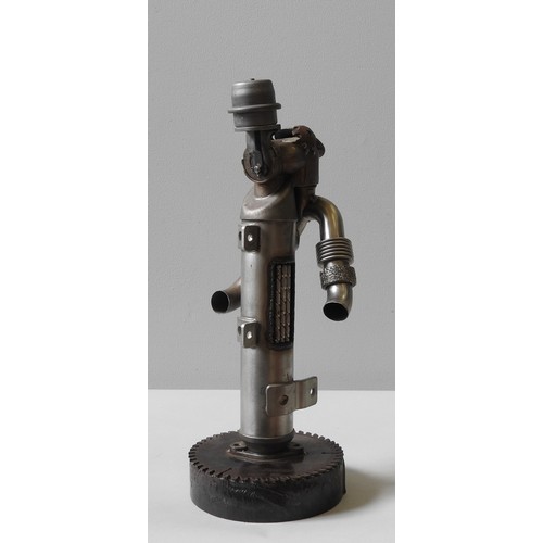 382 - IN THE MANNER OF JOE RUSH, A SCRAP METAL SCULPTURE, pipe work figure, by Ian Coiley (signed on under... 