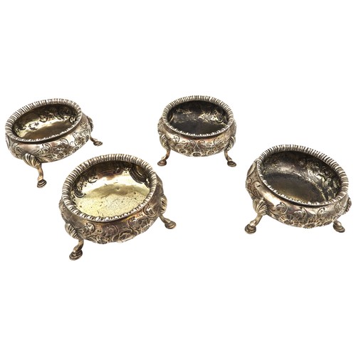 340 - A SET OF FOUR VICTORIAN SILVER SALTS, circular form, gadrooned rim with floral repousse decoration, ... 